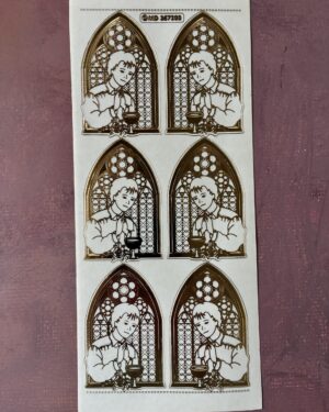 Communion Boy Transparent Gold. Shows peel off sticker sheet with six images of a boy standing in front of a church window in a gold colour.