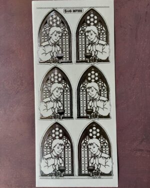 Communion Boy Transparent Silver. Shows peel off sticker sheet with six images of a boy standing in front of a church window in a silver colour.