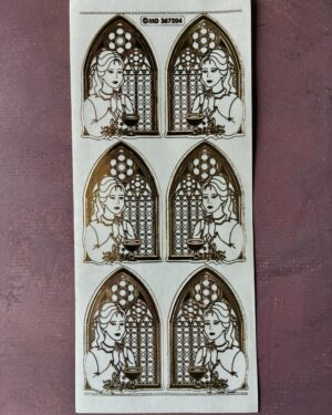 Communion Girl Transparent Gold. Shows peel off sticker sheet with six images of a girl standing in front of a church window in a gold colour.